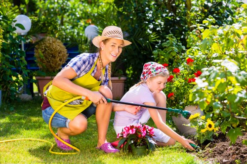 Garden tools arranged for maintenance in a Ruislip garden